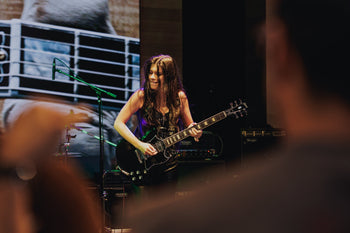 Larissa Liveir on stage at the Gibson Garage Miami