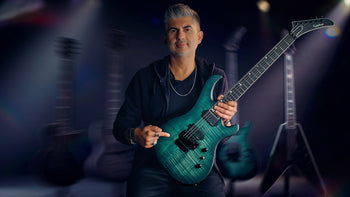 epiphone-prophecy-reveal-image -man holding epiphone prophecy victory fr