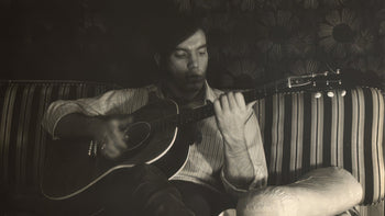 Mark Sebastian with his Epiphone Cortez acoustic guitar