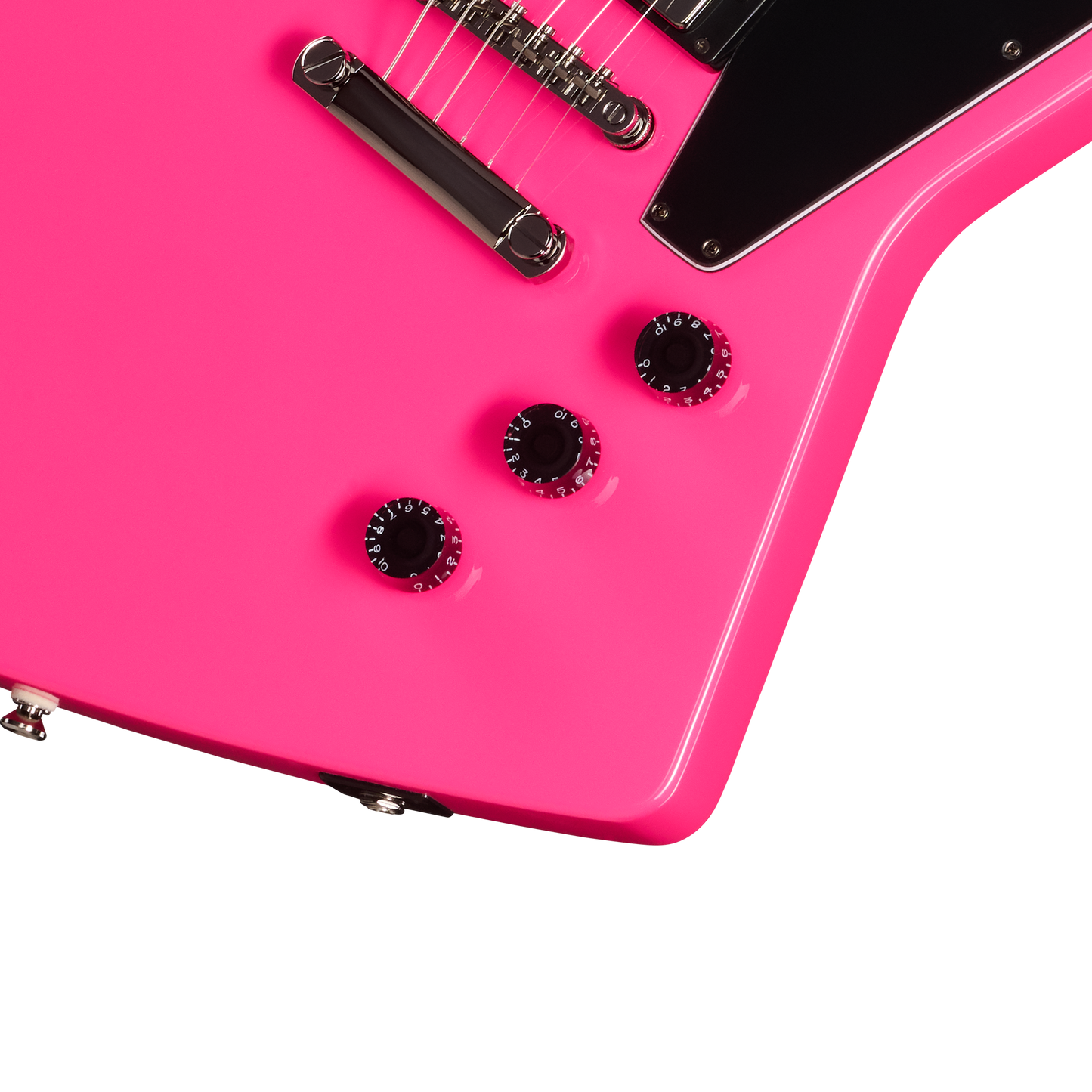 Close-up of a pink electric guitar with a white background