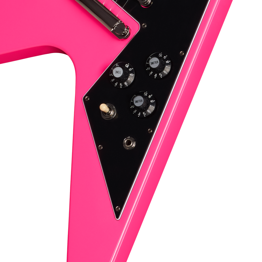 Close-up of a pink electric guitar with black control panel on a white background