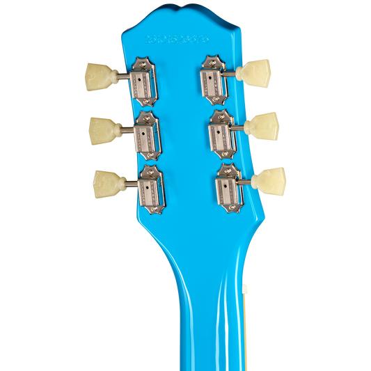 Close-up of a bright blue guitar headstock with six silver tuning pegs and cream-colored knobs on a white background.