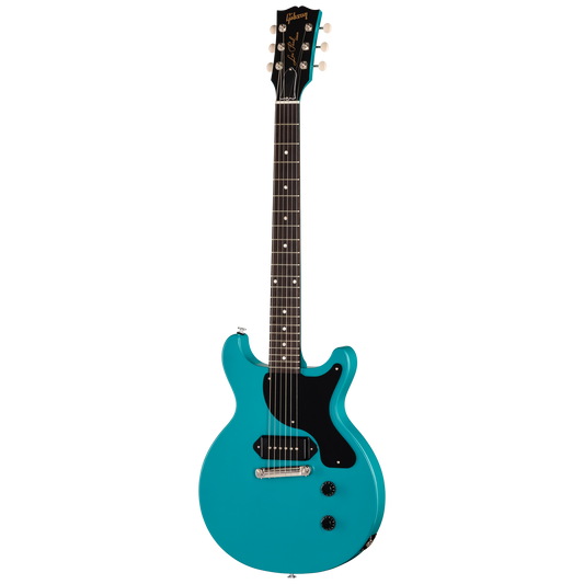 Turquoise electric guitar on a white background