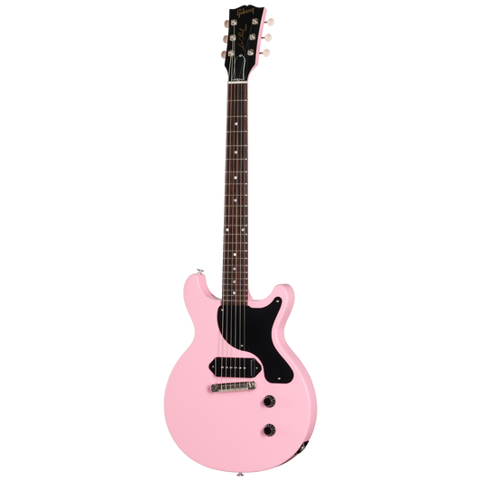 Pink electric guitar with black pickguard on a white background