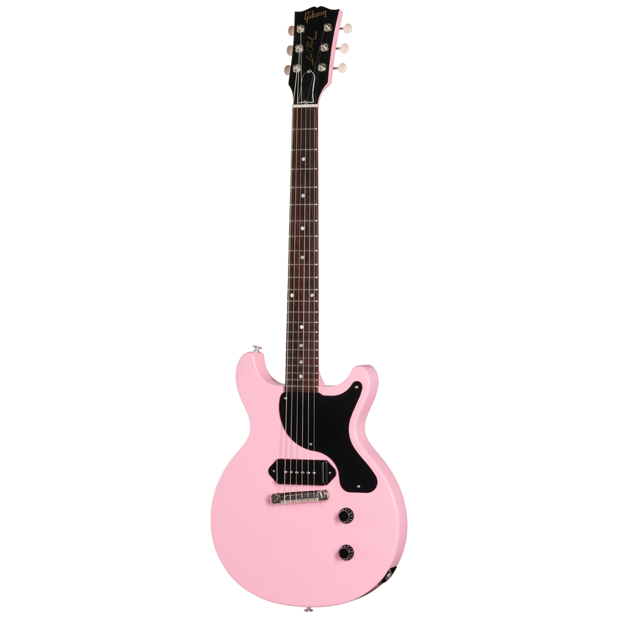 Pink electric guitar with black pickguard on a white background