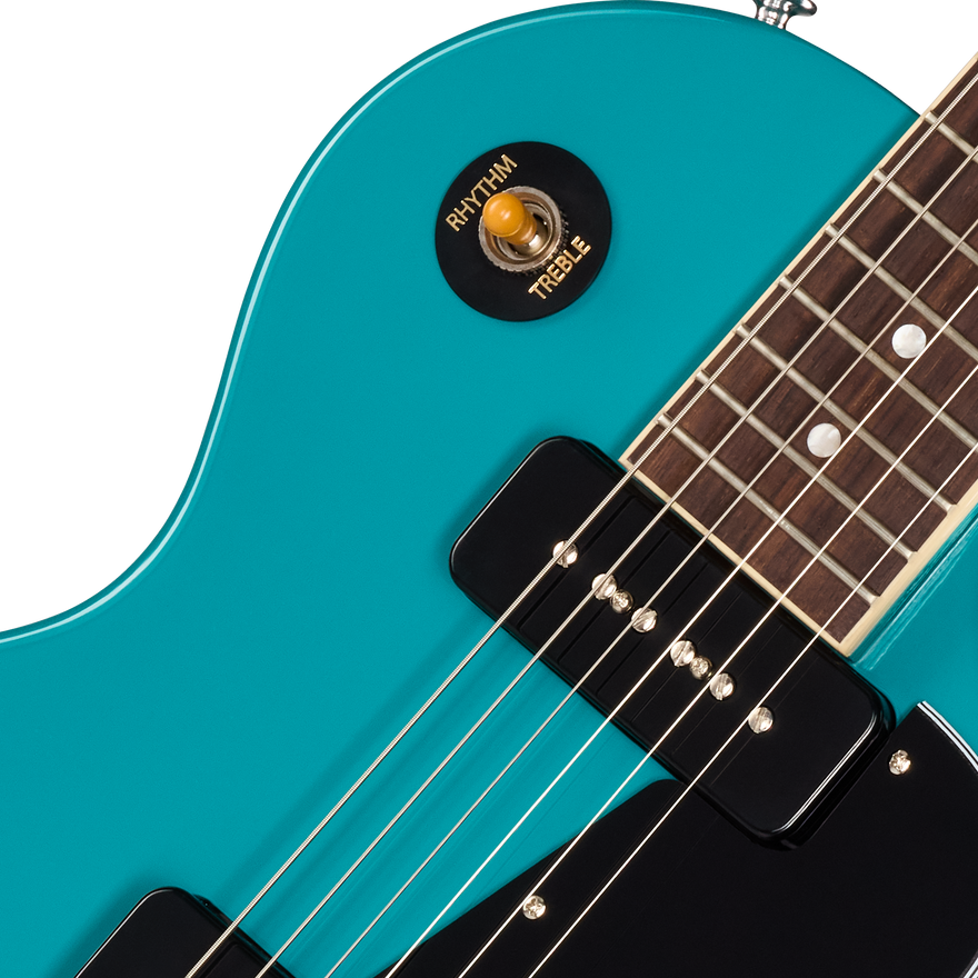 Close-up of a turquoise electric guitar with a focus on the neck and tuning pegs.
