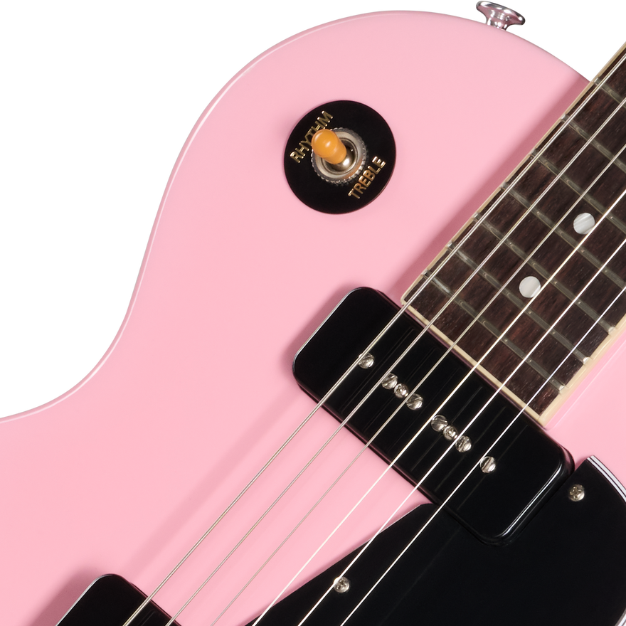 Close-up of a pink electric guitar with a white background