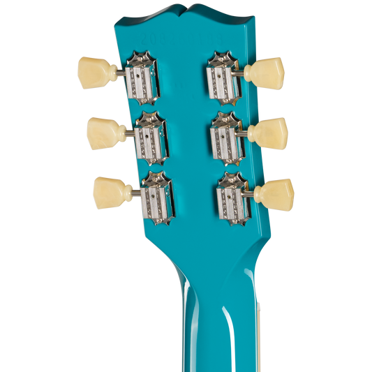 Close-up of a turquoise guitar headstock with tuning pegs on a white background