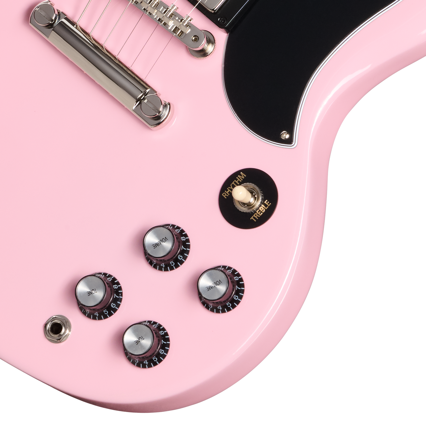 Close-up of a pink electric guitar with control knobs on a white background