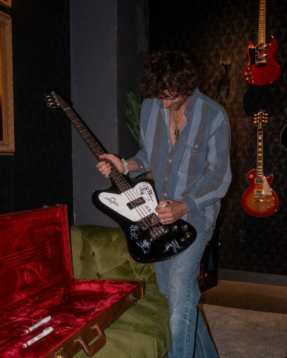 Tyson Ritter of The All-American Rejects signing the Gibson Non-Reverse Thunderbird 